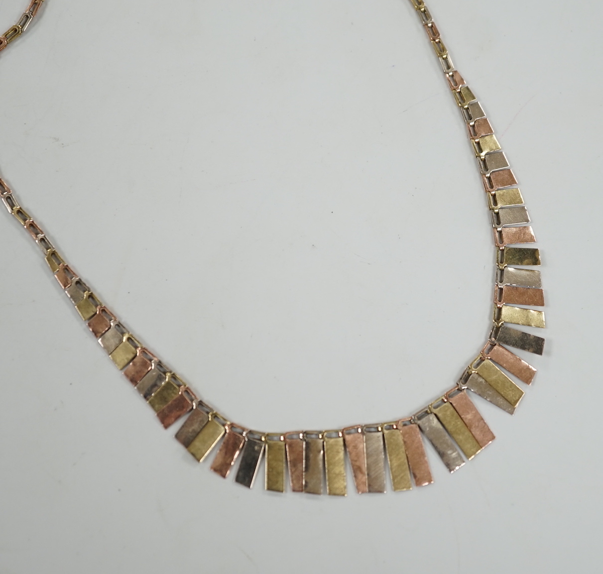 A modern three colour 9ct gold fringe necklace, 40cm